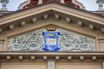 Architectural details of Old Market Hall (Vanhakauppahalli, 1889) building. Merchants sell everything from cheese, fish, vegetable, fruit, cakes, spices, coffee and tea. Helsinki, Finland.