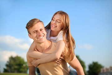 Happy young couple on sunny summer day