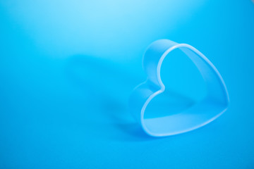 Love concept with heart shape on blue background, valentines day