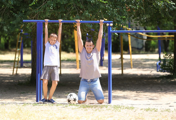 Little boy and his dad on playground