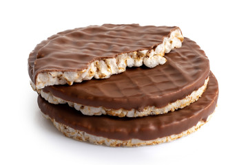 Stack of two and half chocolate rice cakes isolated on white.