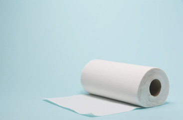 White tissue paper, toilet paper on blue background.