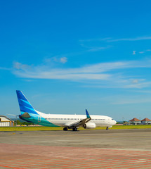 Fototapeta na wymiar Airplane takeoff Bali airport runway
