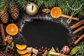  cones and spruce branches on the New Year`s black background.