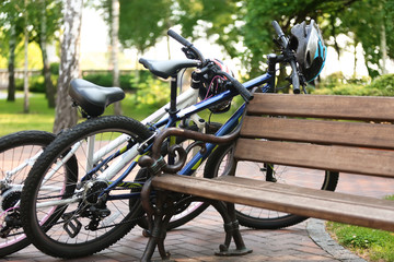Modern bicycles in park on summer day
