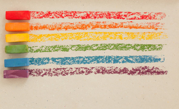Multi-colored soft oil pastels in a row