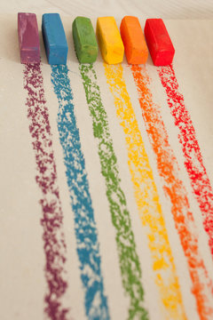 Multi-colored soft oil pastels in a row