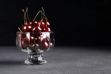 bowl of cherries on a dark background