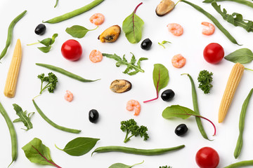 Fresh vegetables and seafood on white background