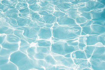 Texture of water in swimming pool for background