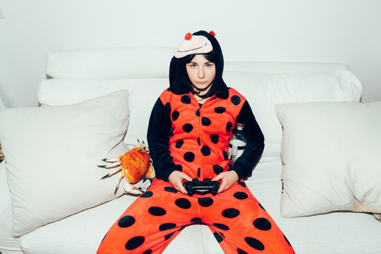 Woman wearing adult bodysuit holding games controller