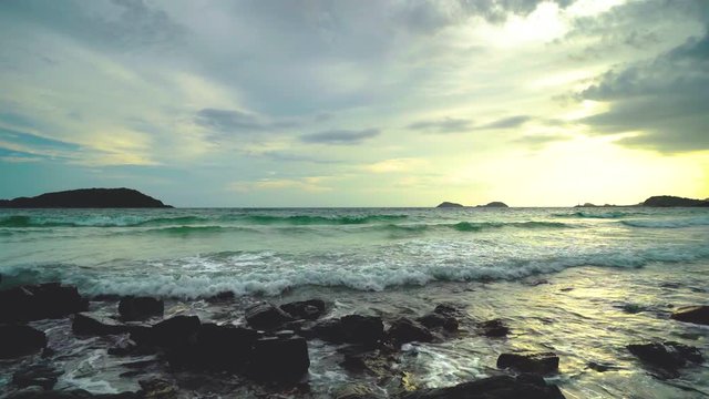 Ocean wave with large wave crashing on rock