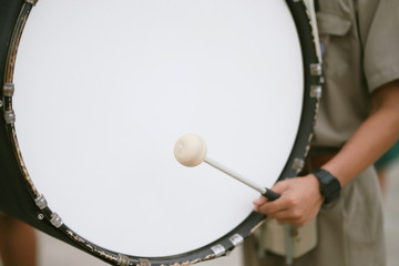 Fototapeta na wymiar Drummer Playing A Bass Drum in Parade