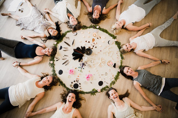 Women around circle in yoga retreat