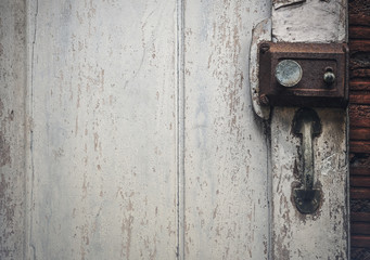 Old rusty door lock on wooden antique door