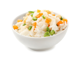 Bowl with tasty boiled rice and vegetables on white background