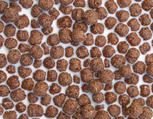 Chocolate cereal balls and milk. Healthy breakfast.