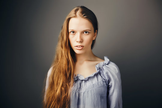Young woman, grey background