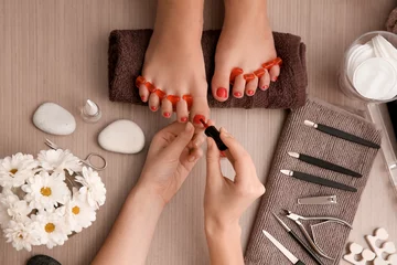 Peel and stick wall murals Pedicure Young woman getting professional pedicure in beauty salon
