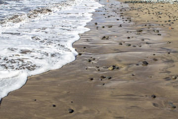 Sand beach with sea stones
