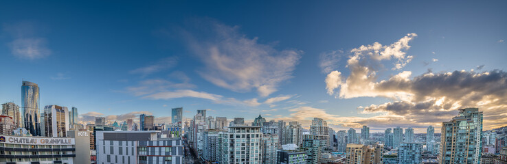 Fototapeta na wymiar Panorama of Vancouver's Yaletown district with blue sky and clouds
