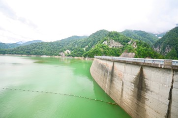 View of the Arch of Kurobe Dam and Emerald Green Water Along Tateyama Kurobe Alpine Route