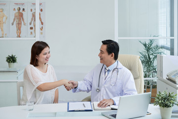 Fototapeta premium Happy doctor and patient