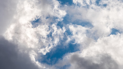dark clouds and blue sky