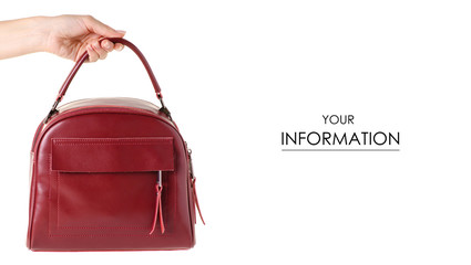 Red leather female bag in hand pattern on white background isolation