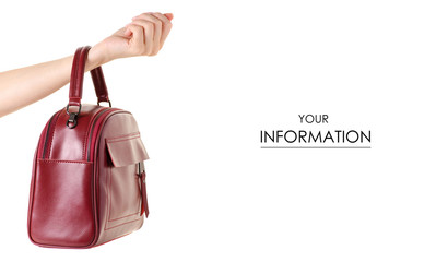 Red leather female bag in hand pattern on white background isolation