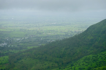 Obraz premium Lush green monsoon nature landscape mountains, hills, Purandar, Maharashtra, India 