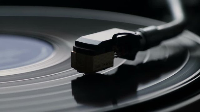 Close-up of using an antiquarian vinyl record player