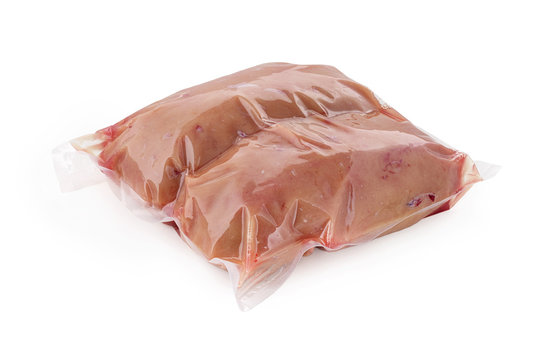 Raw bovine eggs bull testicles in a vacuum package on a white background isolated