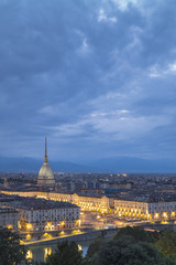 Fototapeta na wymiar blue evening and golden city lights in Turin in summer day in Italy