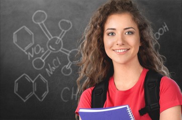 Portrait of a cute young student girl