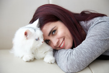 Smiling woman with cat