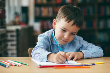 Preschool boy drawing