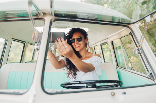 Woman driving retro car
