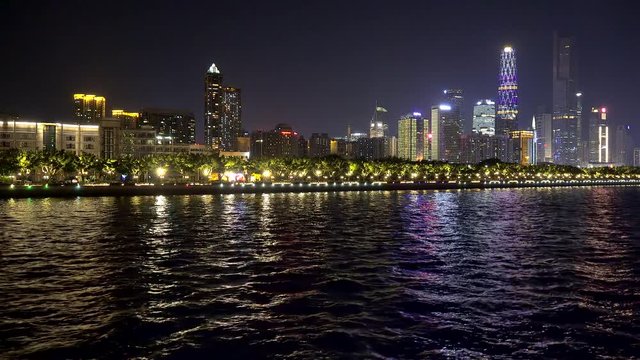Bright color lighting of Zhujiang New Town Guangzhou from the boat of Pearl River Cruise by night. Guangdong, China.