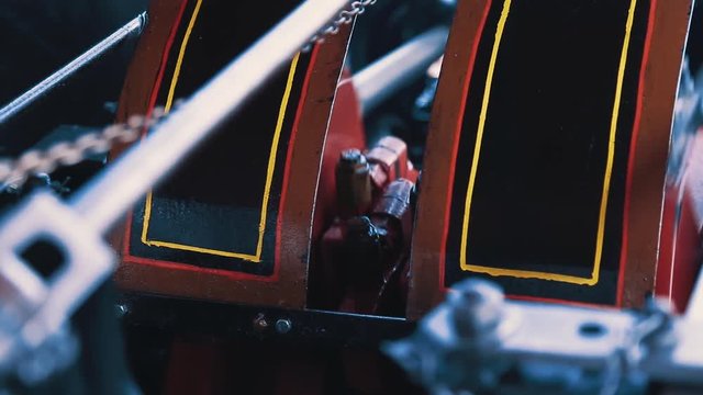 Steam powered pistons pumping and turning on a traction engine