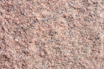 Facing material rose granite texture. Natural stone rose granite untreated background texture.