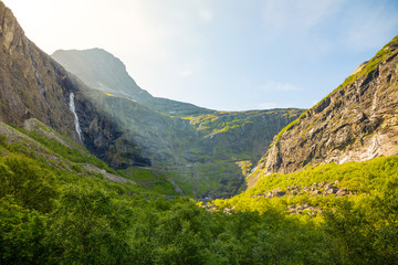 Fototapeta premium Norwegian national travel rout ewith mountain peaks on the horizon, view from Road to Trollstigen, Norway.