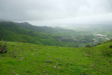 Fototapeta na wymiar Lush green monsoon nature landscape mountains, hills, Purandar, Maharashtra, India 