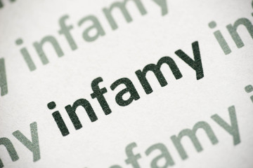 word infamy printed on paper macro