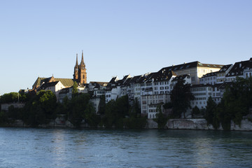 Fototapeta na wymiar Basel with the river Rhine in the foreground and Basel's Old Town district in the background.