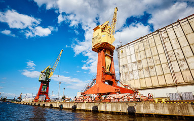 Harbor infrastructure seen from water, Szczecin, Poland. - obrazy, fototapety, plakaty