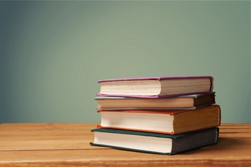 Collection of old books on wooden table