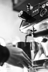 making espresso coffee close up detail with modern machine