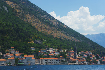 Sea bay with a small old town by the sea in the mountains.