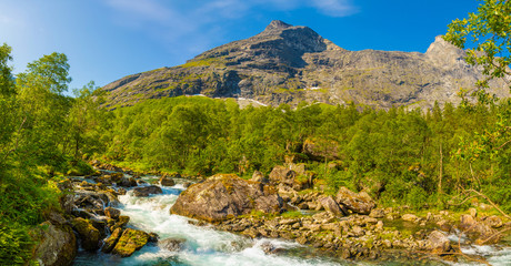 Norwegian landscape with mountain river near Trollstigen in Norway